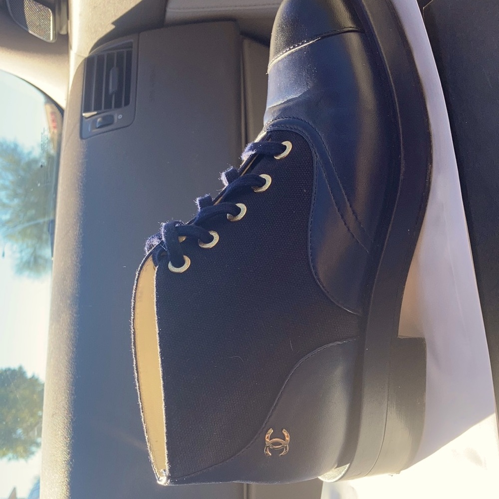 Authentic CHANEL cap-toe boots.
